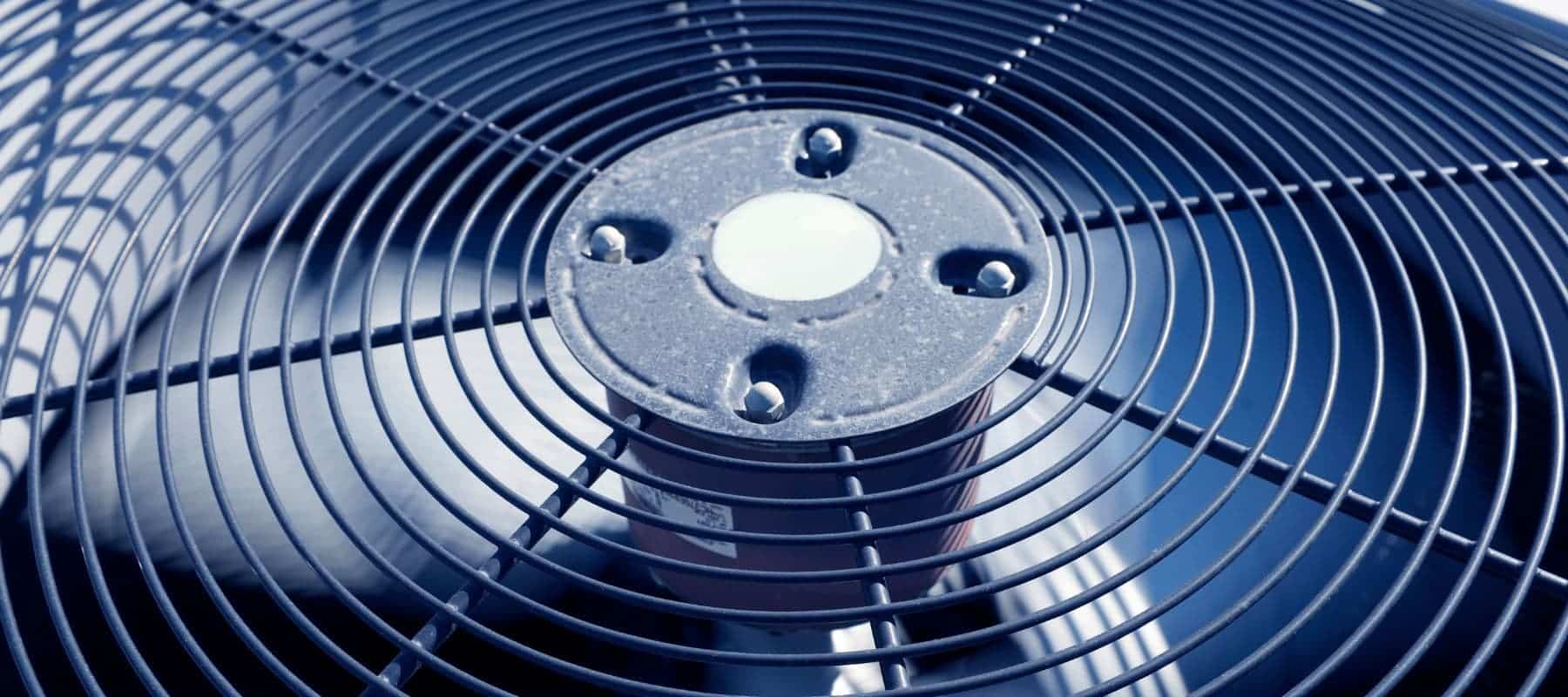 closeup of an outdoor hvac unit top fan