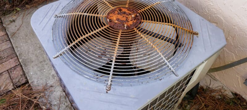 closeup of the top of a rusted outdoor hvac unit